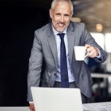 happy-businessman-portrait-lapto